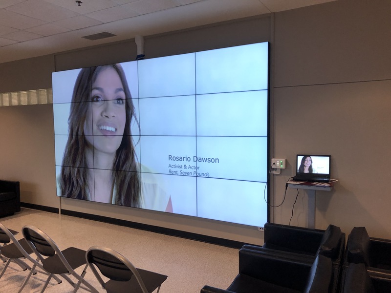 IU Northwest IQ Wall with Woman's headshot on screen with connecting computer available.