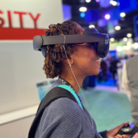 An image of a person wearing the Meta Quest Pro to experience the AVLs virtual environment.