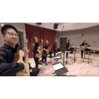 Six students in black uniforms playing guitar in a semi-circle formation via Matterport scan
